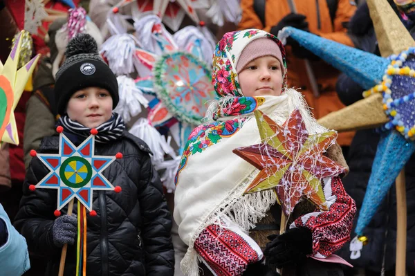 Lviv, Ukraine, 8 January 2022. Children hold stars during procession of zvizdari (Christmas Star carriers) held as part of the Spalakh rizdvianoi zvizdy (The Flash of the Christmas Star) Festival in Lviv, western Ukraine. Every year, enthusiasts take