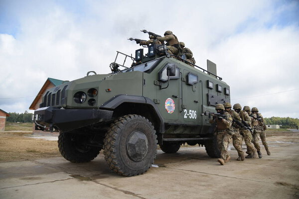 Ukrainian soldiers ride armored vehicle during a joint military exercise Rapid Trident 2019 at a at the International Center for Peacekeeping and Security of the National Academy of Land Forces near Lviv.