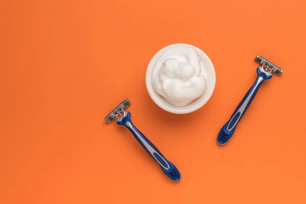 Two Blue Razors White Cup Shaving Foam Orange Background Space — Stock Photo, Image