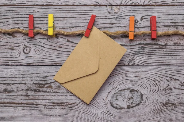 Multicolored Clothespins Closed Postal Envelope Rope Wooden Background Concept Communication — 图库照片