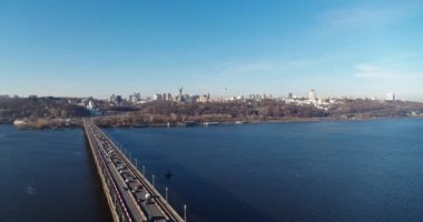 City traffic on the big bridge at the autumn aerial view