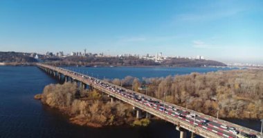 City traffic on the big bridge at the autumn aerial view