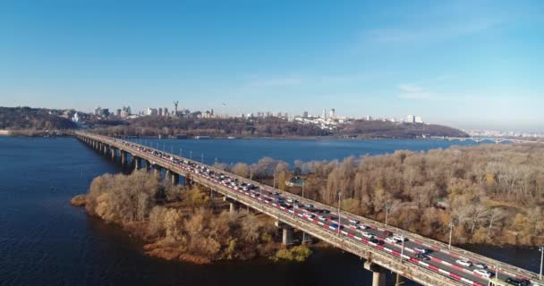 City traffic on the big bridge at the autumn aerial view — Video