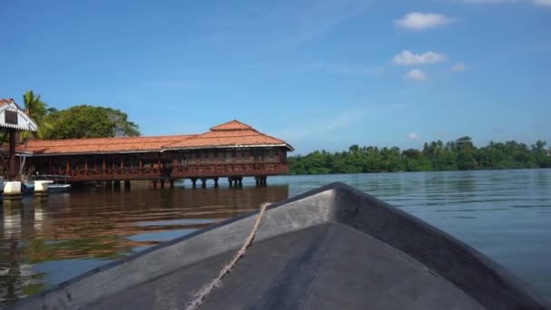 Boat ride along the mangrove trees and houses on the water first person view — Stock Video