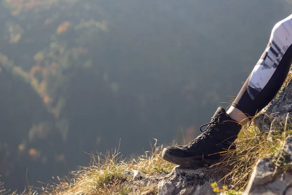 Woman hicker foot on the mountain top