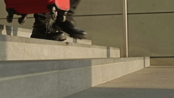 Legs of different people going down the stairs of an underpass or subway. — Stock Video