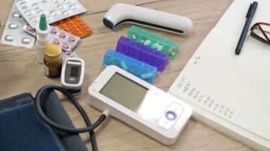 Bedside table of a sick person. Various medicines and devices necessary for a sick person.