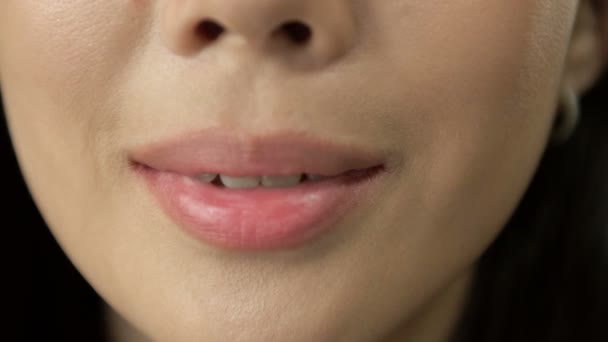 Beautiful macro shot of white teeth with braces.Beauty woman smile with ortodontic accessories. Orthodontics treatment. Closeup of healthy female mouth. — Stockvideo