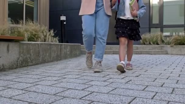 Mom Meets Her Little Daughter School Young Woman Holds Hand — Stockvideo