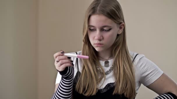 Teenage Girl Looks Fearfully Pregnancy Test — Stockvideo