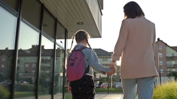 Young Woman Takes Her Little Daughter School Mom Holds Hand — Stockvideo