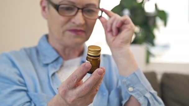 Woman Carefully Considers Medicines Prescribed Her — Vídeo de stock