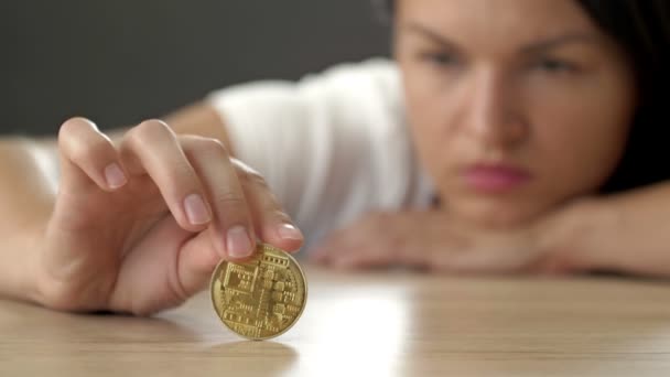 Frustrated Woman Rolls Bitcoin Coin Table Course Most Popular Cryptocurrency — Vídeos de Stock