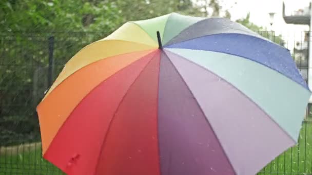 Rotating Motley Umbrella Rain — Vídeo de Stock