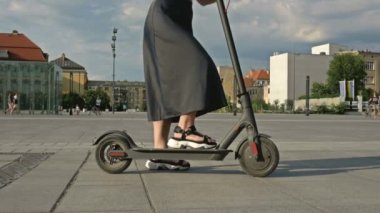 Woman on an electric scooter. 4K.