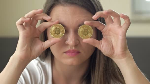 Cheerful Woman Playfully Covers Her Eyes Gold Coins Bitcoins — Stok video