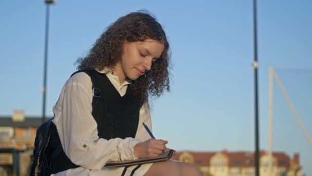 Cute High School Girl Uniform Writes Something Notebook She Sits — Stock Video