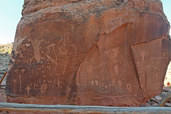 "The birthing" petroglyphs carved on a boulder in Utah.