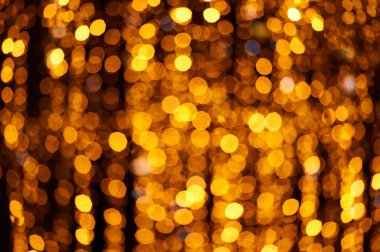 Soyut Noel altınları. Odaklanamayan ışıklar arka plan. Nesneler ve metin için alanı olan yeni yıl arkaplanı modelle