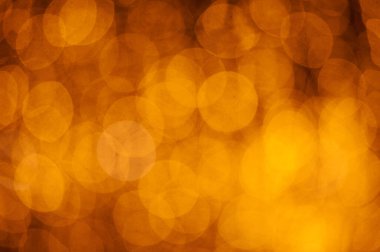 Soyut Noel altınları. Odaklanamayan ışıklar arka plan. Nesneler ve metin için alanı olan yeni yıl arkaplanı modelle