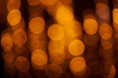 Soyut Noel altınları. Odaklanamayan ışıklar arka plan. Nesneler ve metin için alanı olan yeni yıl arkaplanı modelle