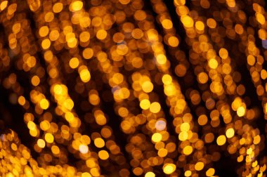 Soyut Noel altınları. Odaklanamayan ışıklar arka plan. Nesneler ve metin için alanı olan yeni yıl arkaplanı modelle