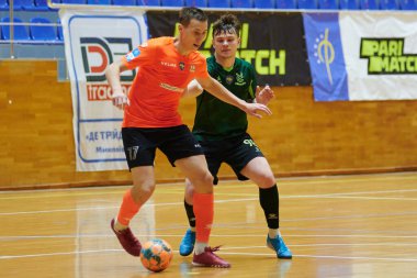 KHARKIV, UKRAINE - 11 Aralık 2021 Ukrayna ExtraLeague Viva Cup Monolit Donbass Energo Trading 'e karşı futsal maçı