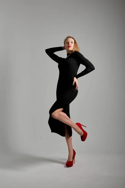 Pretty Young Female Makeup Black Dress Red Shoes Posing Camera — стоковое фото