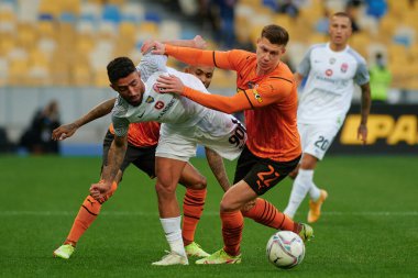 KYIV, UKRAINE - OCTOBER 15, 2021: midfielder Fernando (99) defender Mykola Matviyenko (22) vs Allahyar Sayyadmanesh (90). The football match of UPL, FC Shakhtar Donetsk vs FC Zorya Luhansk