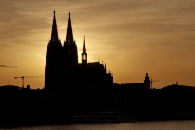 COLOGNE, GERMANY - JUNE 17 2022: Silhouette of Cologne Cathedral. Cityscape of Cologne during sunset. 