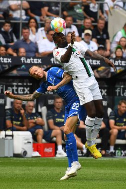 MOENCHENGLADBACH, GERMANY - AUGUST 6, 2022: Kevin Vogt vs Marcus Thuram. The football match of Bundesliga  Borussia Moenchengladbach vs TSG 1899 Hoffenheim.