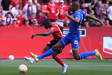 Leverkusen, Germany - August 20, 2022: Moussa Diaby vs Kevin Akpoguma. The match of Bundesliga FC Bayer 04 Leverkusen vs TSG 1899 Hoffenheim