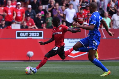 Leverkusen, Germany - August 20, 2022: Moussa Diaby vs Kevin Akpoguma. The match of Bundesliga FC Bayer 04 Leverkusen vs TSG 1899 Hoffenheim