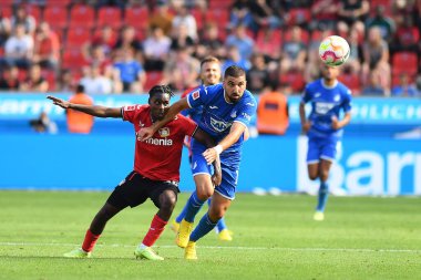 Leverkusen, Germany - August 20, 2022: Jeremie Frimpong vs Munas Dabbur. The match of Bundesliga FC Bayer 04 Leverkusen vs TSG 1899 Hoffenheim