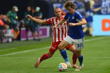 GELSENKIRCHEN,  GERMANY - AUGUST 27, 2022: Alex Kral vs Julian Ryerson. The football match of Bundesliga FC Schalke 04 vs Union Berlin