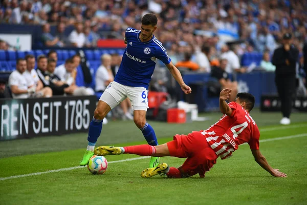 GELSENKIRCHEN,  GERMANY - AUGUST 27, 2022: Diogo Leite vs Tom Krauss. The football match of Bundesliga FC Schalke 04 vs Union Berlin