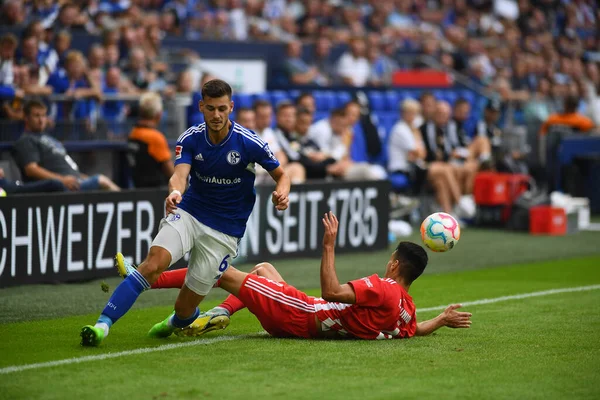 GELSENKIRCHEN,  GERMANY - AUGUST 27, 2022: Diogo Leite vs Tom Krauss. The football match of Bundesliga FC Schalke 04 vs Union Berlin