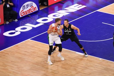 COLOGNE, GERMANY - SEPTEMBER 4, 2022: Johannes Voigtmann vs Domantas Sabonis. The basketball match of Eurobasket 2022 Lithuania vs Germany