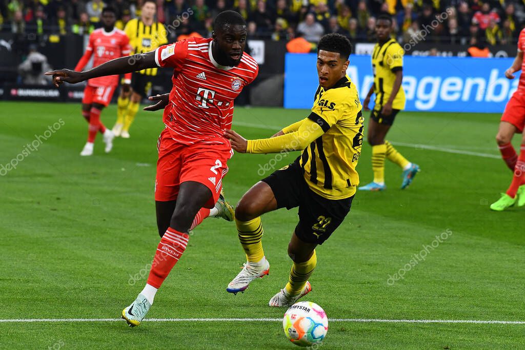 DORTMUND, GERMANY - OCTOBER 8, 2022: Jude Bellingham vs Dayot Upamecano. The football match of Bundesliga  Borussia Dortmund vs Bayern Munich