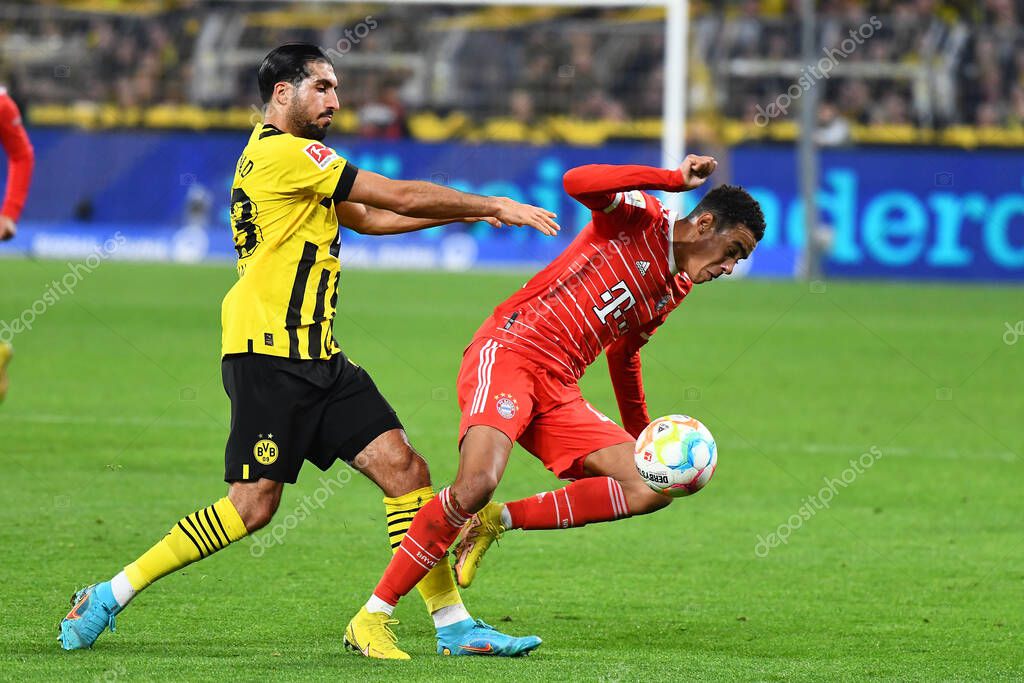 DORTMUND, GERMANY - OCTOBER 8, 2022: Emre Can, Jamal Musiala. The football match of Bundesliga  Borussia Dortmund vs Bayern Munich