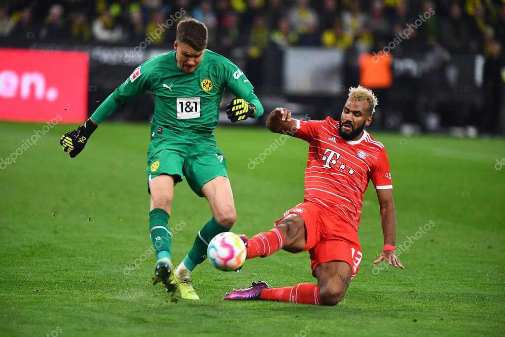 DORTMUND, GERMANY - OCTOBER 8, 2022: Alexander Meyer, Eric Maxim Choupo-Moting. The football match of Bundesliga  Borussia Dortmund vs Bayern Munich
