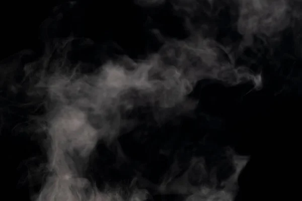 黒い背景に蒸気と蒸気が立ち上がる — ストック写真