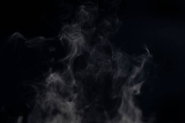 Steam and steam rising on a black background