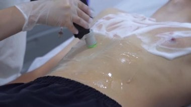 Beauty salon client remove chest hair. Laser hair removal procedure for young man. Male person at cosmetologist office on total body depilation. Smooth and healthy skin concept.