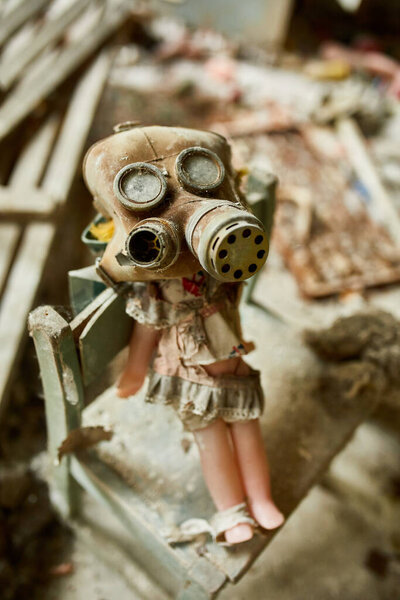 Broken, destroyd, abandoned kindergarten in Chernobyl Exclusion Zone, Lost toys, A broken plastic doll, Ukraine, ghost town Pripyat.