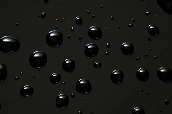 Abstrakte Wassertropfen Auf Schwarzem Hintergrund Makro Blasen Nahaufnahme Kosmetische Flüssigkeitstropfen — Stockfoto