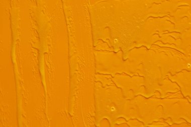 Krem sıvısı jel serumu sarı doku, makyaj ve kozmetik arka plan, cilt veya saç ürünü üzerine akar