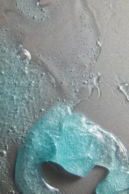 Gümüş doku, makyaj ve kozmetik arka plan, cilt bakımı veya saç ürünü üzerine mavi krem sıvı jel serumu