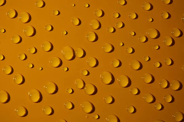 Abstrakcyjne Krople Wody Pomarańczowym Tle Brązu Makro Pęcherzyki Zbliżenie Kosmetyczne — Zdjęcie stockowe