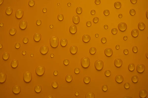 Abstrato Gotas Água Fundo Bronze Laranja Macro Bolhas Perto Cosmético — Fotografia de Stock